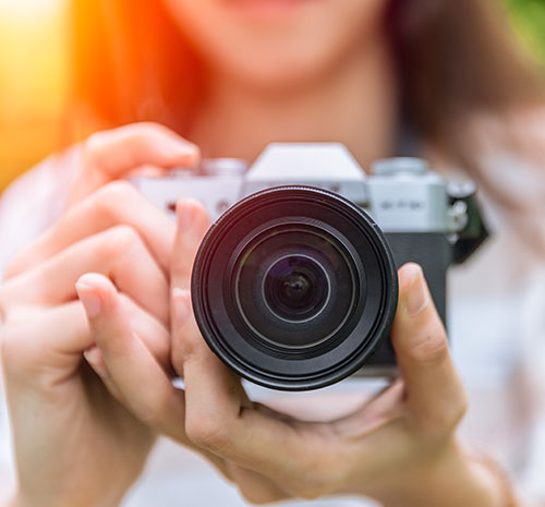 Person holding a camera