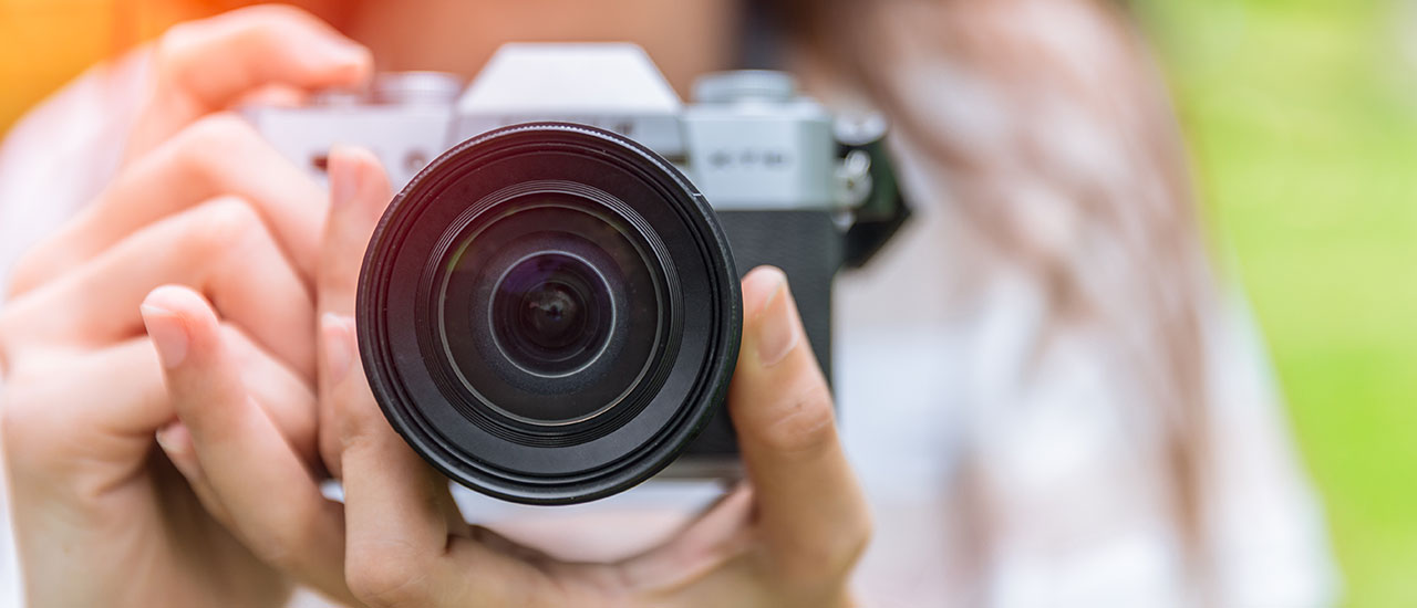 Person holding a camera.