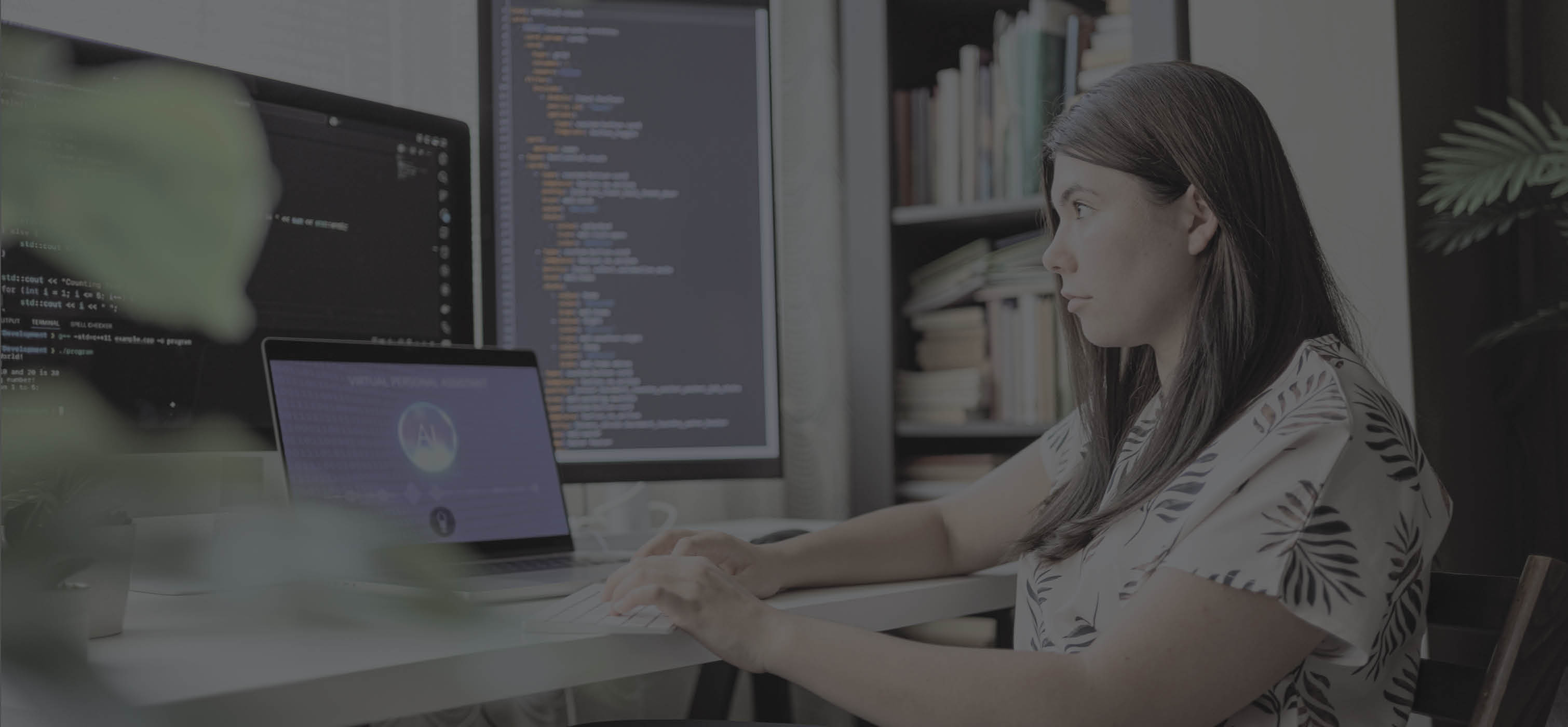 Person sitting at a desk programming