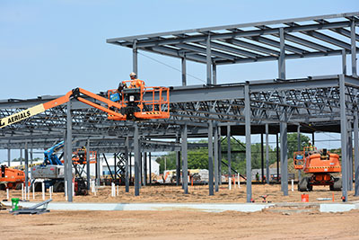 Scissor lift working with beams on the AMETA Center