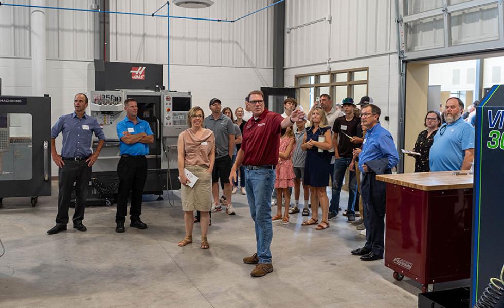 Mid-State Technical College Precision Machining Technician Instructor Mike Berry gives a tour of the Advanced Manufacturing, Engineering Technology, and Apprenticeship (AMETA™) Center at the ribbon cutting event in July.