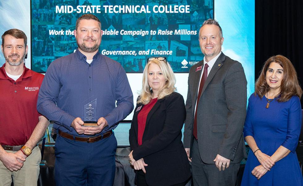 Mid-State’s Bellwether panelist team receives the Showcase Award for their booth presentation in the Planning, Governance and Finance category Bellwether College Consortium’s 31st Annual Community College Futures Assembly (CCFA) held in San Antonio, Texas, Feb. 26. From left: Instructor of Civil Engineering Technology - Highway Technician Mike Johnson, Dean of the School of Applied Technology Ryan Kawski, Director of Foundation & Alumni Micki Dirks-Luebbe and Vice President of Academics Chris Severson. Al