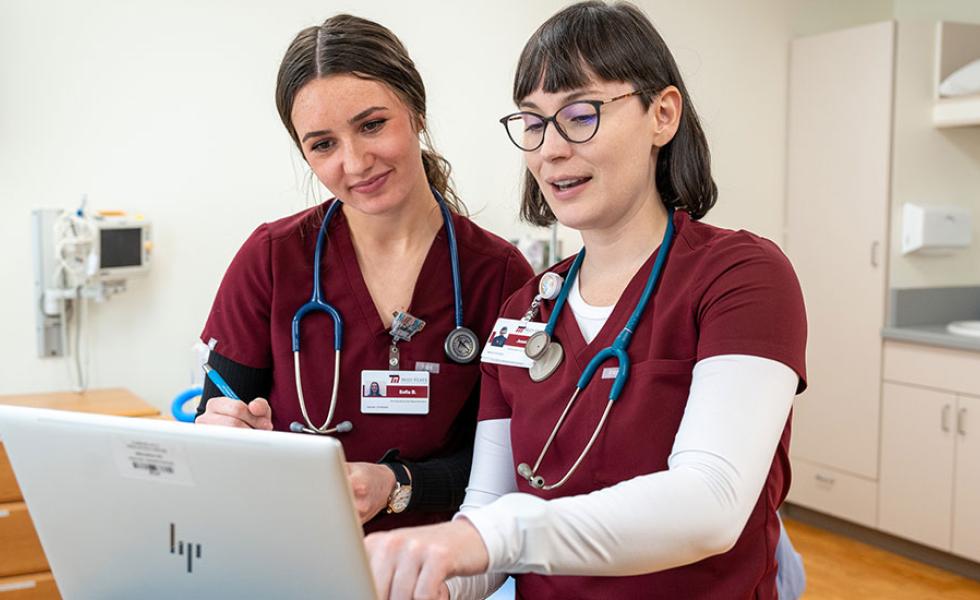 Mid-State Technical College Nursing students working collaboratively to review their patient’s chart in the Healthcare Simulation Center.