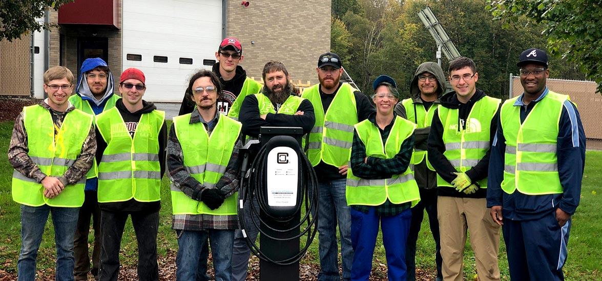 Mid-State Renewable Energy Technician students after installing the electric vehicle car charger on the College’s Marshfield Campus this fall. The new installations also included charging stations at the Adams and Stevens Point campuses, bringing free electric vehicle charging to the public at all Mid-State locations.