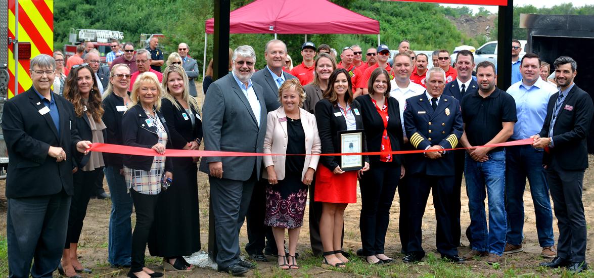 Supporters and partners gathered at the site of the new Stevens Point Fire Department Training Center for the ribbon cutting on Aug. 6. From left, Portage County Business Council (PCBC) Ambassadors Pete Theisen, Karen Olson, Tina Palmgren, Sherri Galle-Teske and Mel Ellingson; Stevens Point Mayor Mike Wiza; Mid-State Associate Dean of Protective and Human Services Rick Anderson; Mid-State President Dr. Shelly Mondeik; State Fire Marshal Lisa Wilson; PCBC Ambassador Melissa Blenker; Rep. Katrina Shankland;