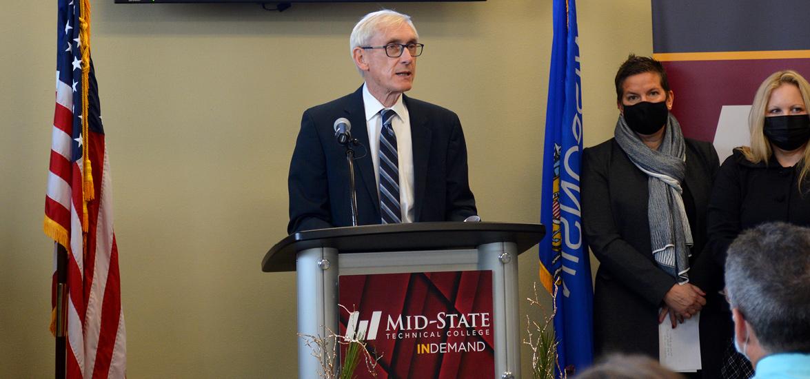 Governor Tony Evers addresses the audience at his press conference to announce Mid-State Technical College’s award of $9 million under the Workforce Innovation Grant program at the College’s Stevens Point Campus, Dec. 12. Also pictured, at right: Wisconsin Economic Development Corporation (WEDC) Secretary and CEO Missy Hughes and Department of Workforce Development (DWD) Secretary-designee Amy Pechacek.