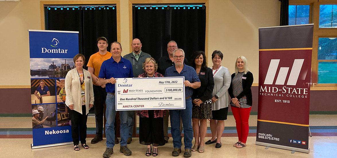 Shown holding Domtar’s check to the Mid-State Technical College Foundation, Inc., from left, are Domtar Maintenance Planner and Mid-State graduate Tom Hintz, Mid-State President Dr. Shelly Mondeik and Domtar Maintenance Planner and Mid-State graduate Romie Bachinski. Also pictured, from left: Mid-State Vice President of Academics Dr. Deb Stencil, Domtar Journeyman Millwright and Mid-State graduate Andrew Melvin, General Manager of Domtar’s Nekoosa Mill Jason McCauley, AMETA Center Campaign Chair Joe Kinse