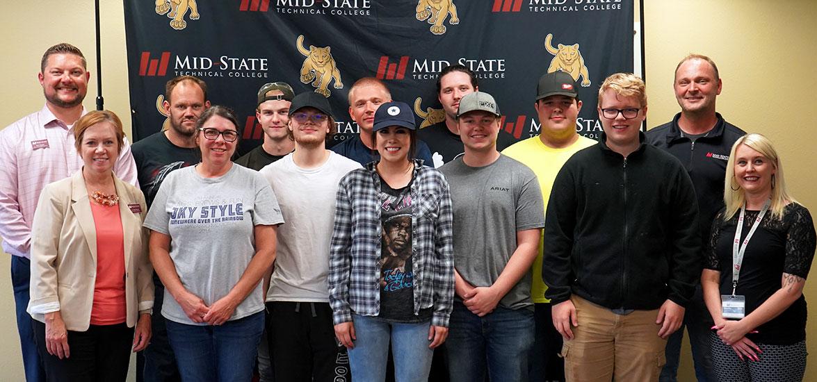 Pictured in the front row, from left: Dr. Deb Stencil, vice president of Academics; graduates Julee Hahn, Jagger Miller, Sierra Saldana, Austin Skoug and Brody Haupt; and Mandy Mayek, associate dean of Applied Technology. Back row, from left: Ryan Kawski, dean of Applied Technology; graduates Jake Stockheimer, Tanner Nelles, Dakota Strebig, Scott Schneider and Jeff Ryta; and instructor Benjamin Will. Not pictured: graduate David Leland.