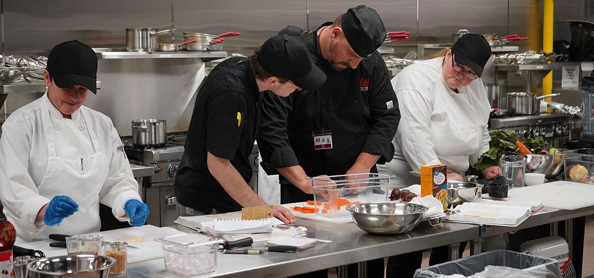 Mid-State Technical College Culinary Arts students and Culinary Arts Instructor Ryan Petrouske in Mid-State’s Culinary Kitchen.