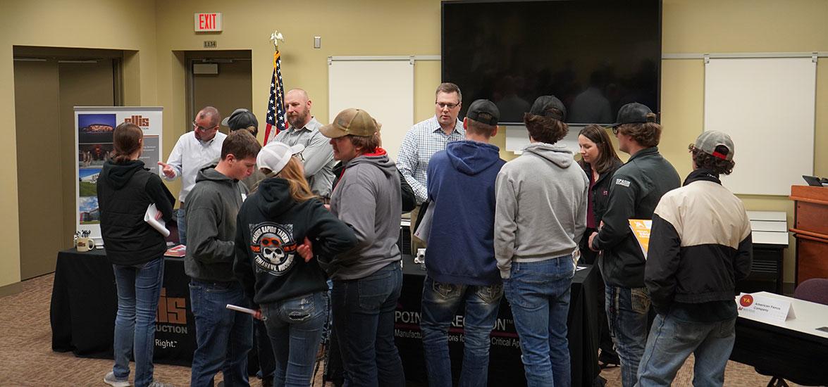 Youth Apprenticeship (YA) to Registered Apprenticeship (RA) Showcase attendees learn about apprenticeship opportunities at Ellis Construction and Pointe Precision, Inc. during the Nov. 2022 YA to RA Showcase Employer Fair on the Wisconsin Rapids Campus.