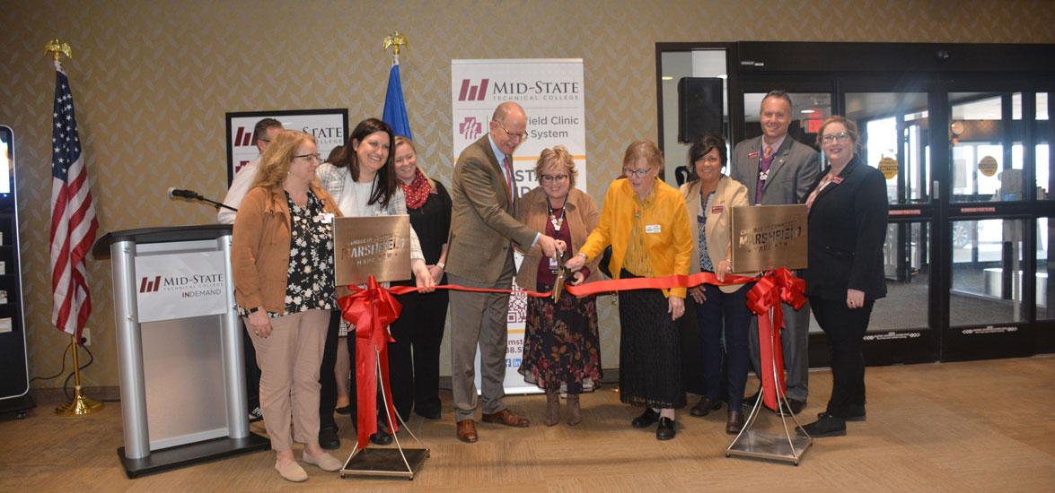 Cutting the ribbon at Mid-State’s new location in Marshfield Clinic.
