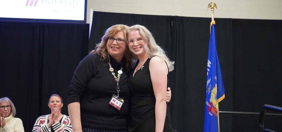 Mid-State Technical College Nursing program graduate Hailey Budtke receives her nursing pin from Mid-State Nursing instructor Carolyn Schneebeli during the College’s pinning ceremony on the Wisconsin Rapids Campus, Dec. 12.