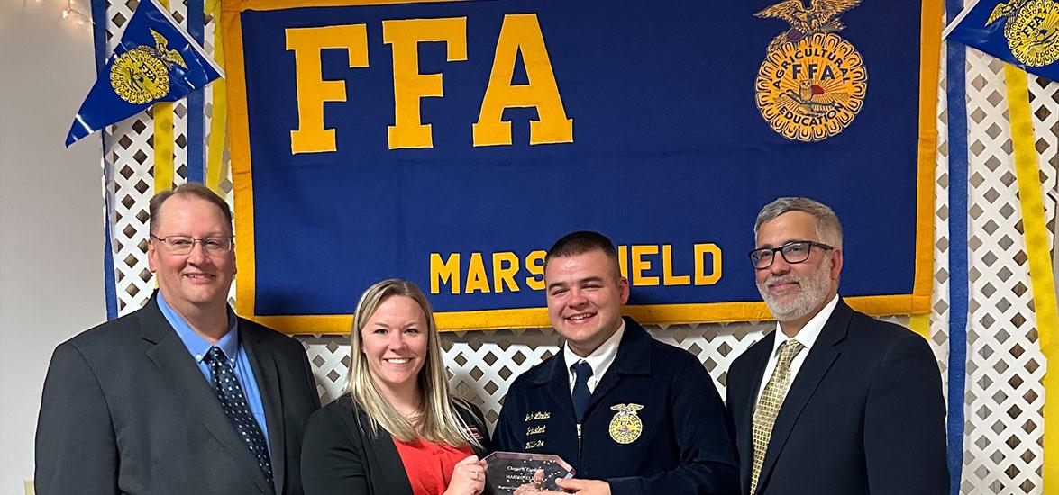 Dr. Alex Lendved (center), Mid-State Technical College dean of Marshfield Campus and School of Applied Technology, presents the Chapter of Excellence Award to the Marshfield High School FFA chapter at Marshfield High School’s annual FFA banquet, May 15.