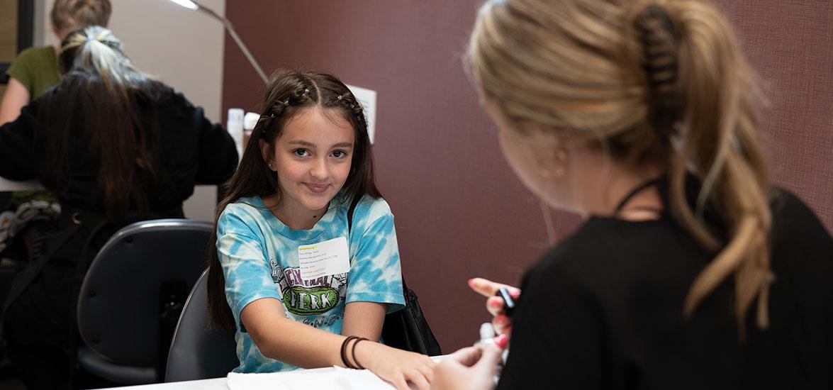 Mid-State Technical College Camp attendee gets her nails done during the Cosmetology session on the Wisconsin Rapids Campus, June 12.