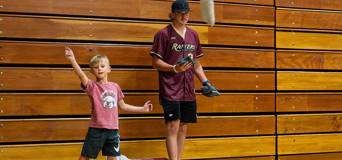 Eli Gosse of Marshfield competes in the Cornhole challenge against Rafters pitcher Tristin Crusenberry at the “Rafters Meet-and-Greet” and “Cuts 4 Kids” event held on Mid-State’s Wisconsin Rapids Campus, June 17.