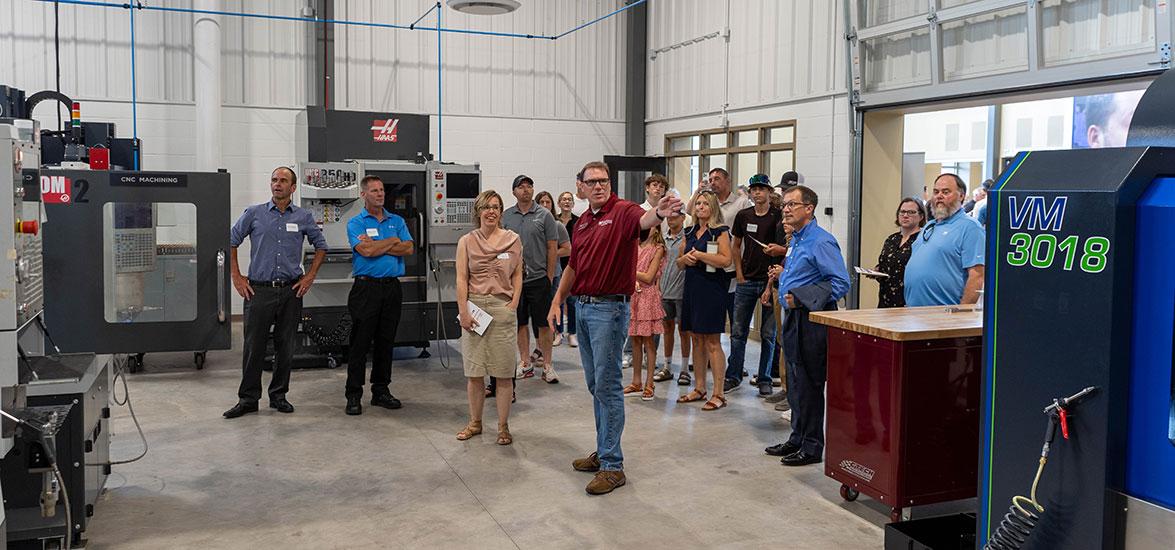 Mid-State Technical College Precision Machining Technician Instructor Mike Berry gives a tour of the Advanced Manufacturing, Engineering Technology, and Apprenticeship (AMETA™) Center at the ribbon cutting event in July.