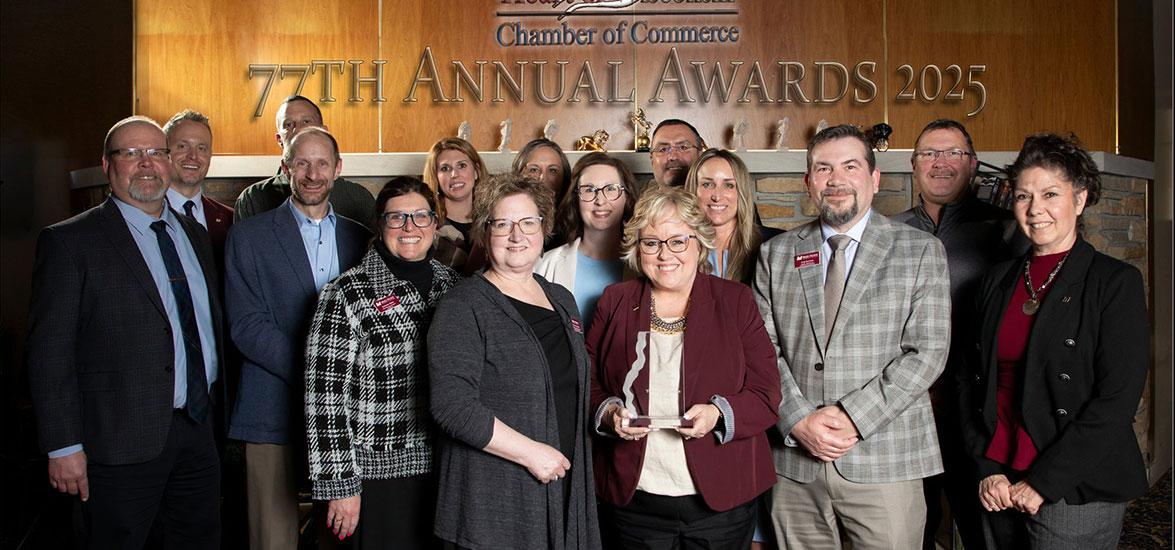 Mid-State Technical College staff and board members after being presented with the Heart of Wisconsin (HOW) Chamber of Commerce Member of the Year award at HOW’s Annual Meeting Awards Banquet on Thursday, March 6, in Wisconsin Rapids, Wis. Holding the award is President Dr. Shelly Mondeik.