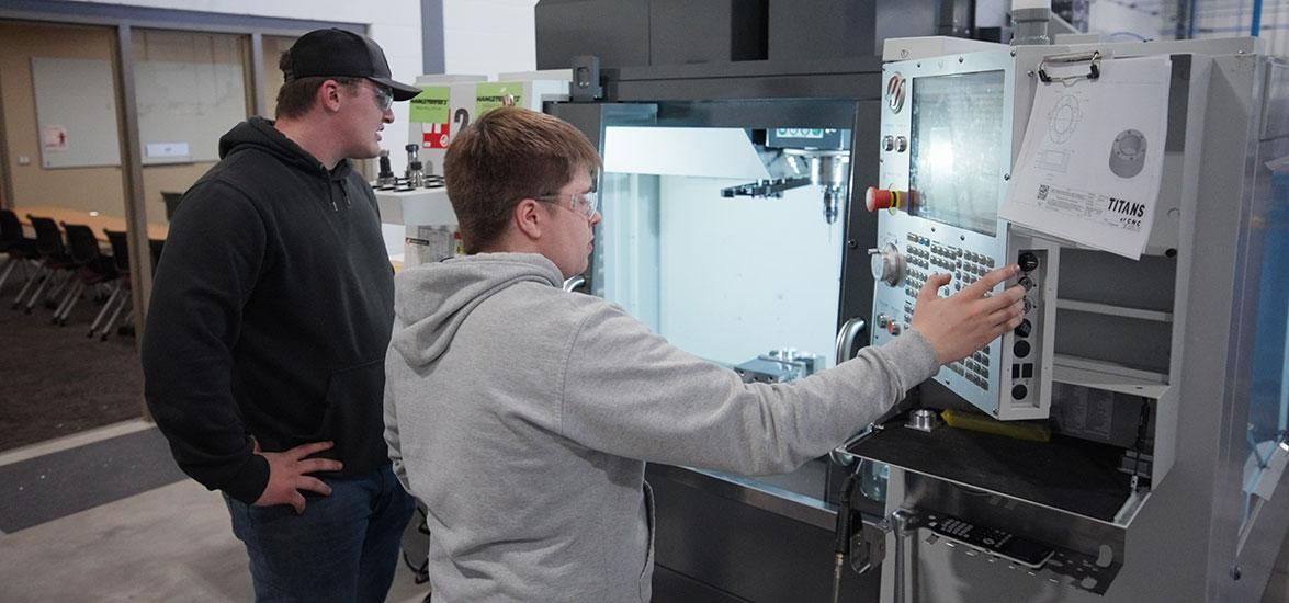 Students operate a CNC machine in Mid-State Technical College’s AMETA Center.