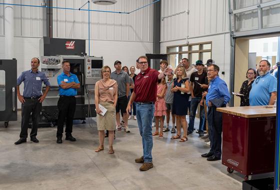 Mid-State Technical College Precision Machining Technician Instructor Mike Berry gives a tour of the Advanced Manufacturing, Engineering Technology, and Apprenticeship (AMETA™) Center at the ribbon cutting event in July.